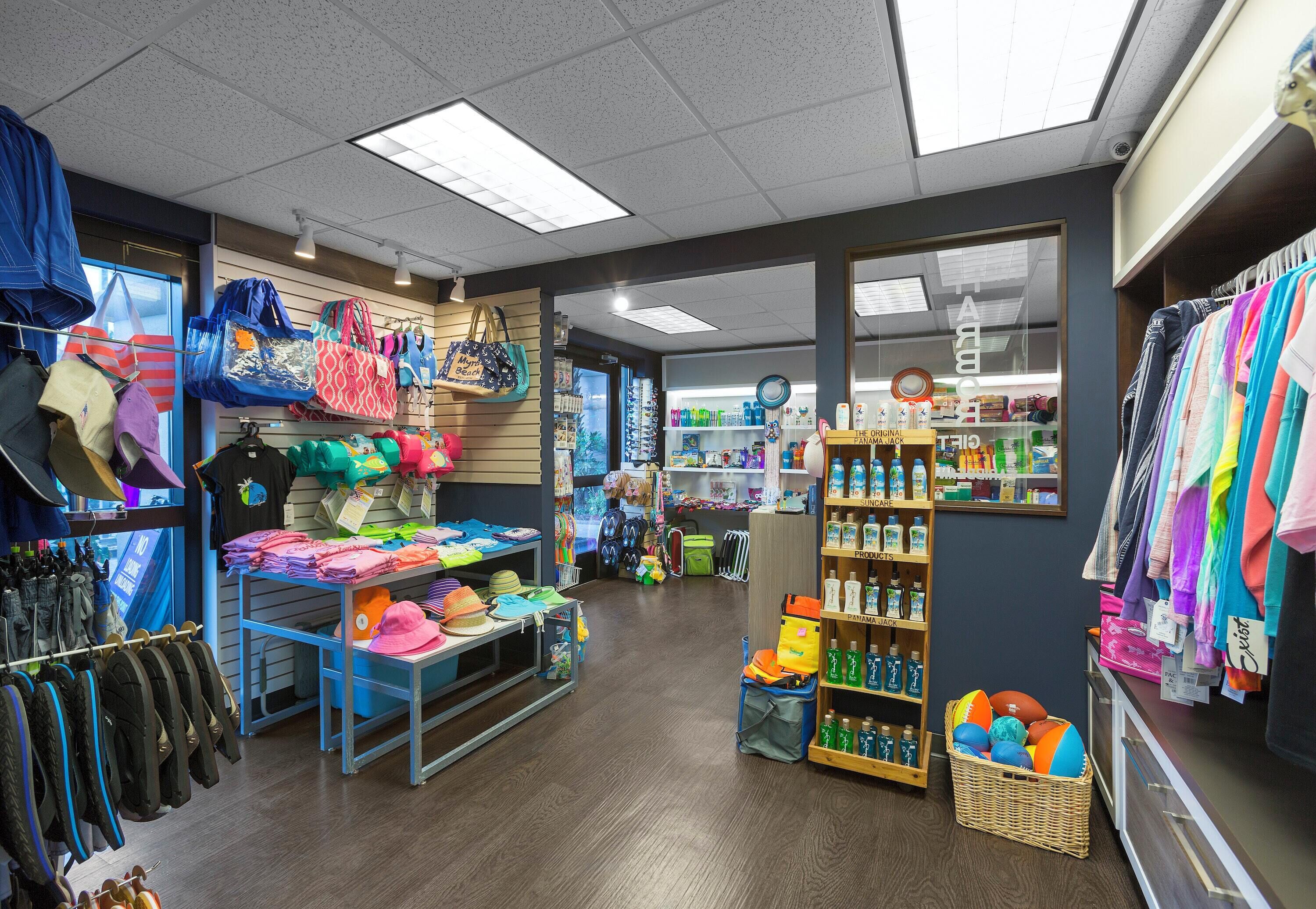 A retail store with various clothing items, including hats, bags, and accessories.