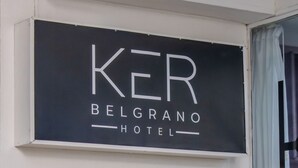 A sign for the KER Belgrano Hotel.