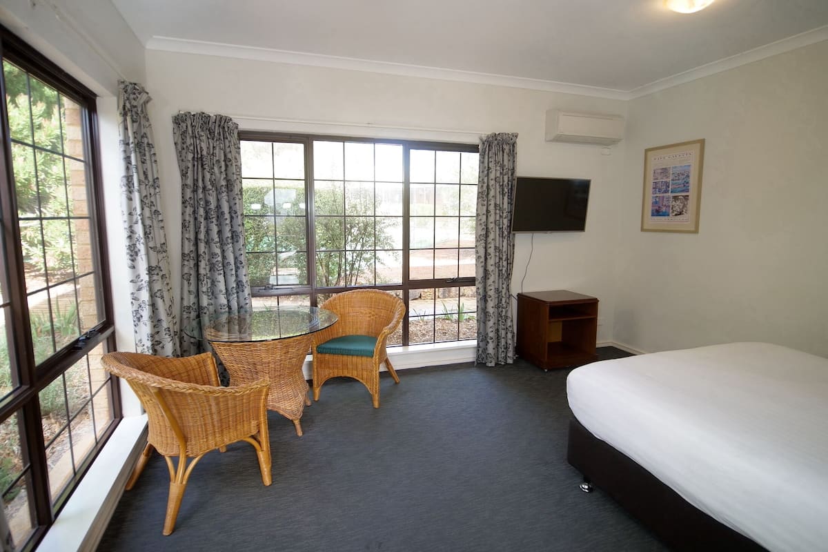 queen spa room | premium bedding, down duvets, desk, iron/ironing board