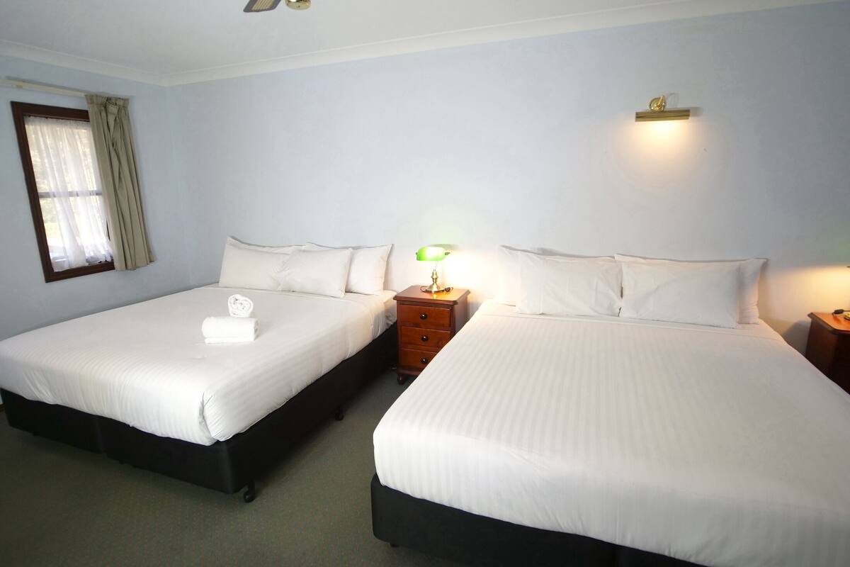 king twin room | premium bedding, down duvets, desk, iron/ironing board