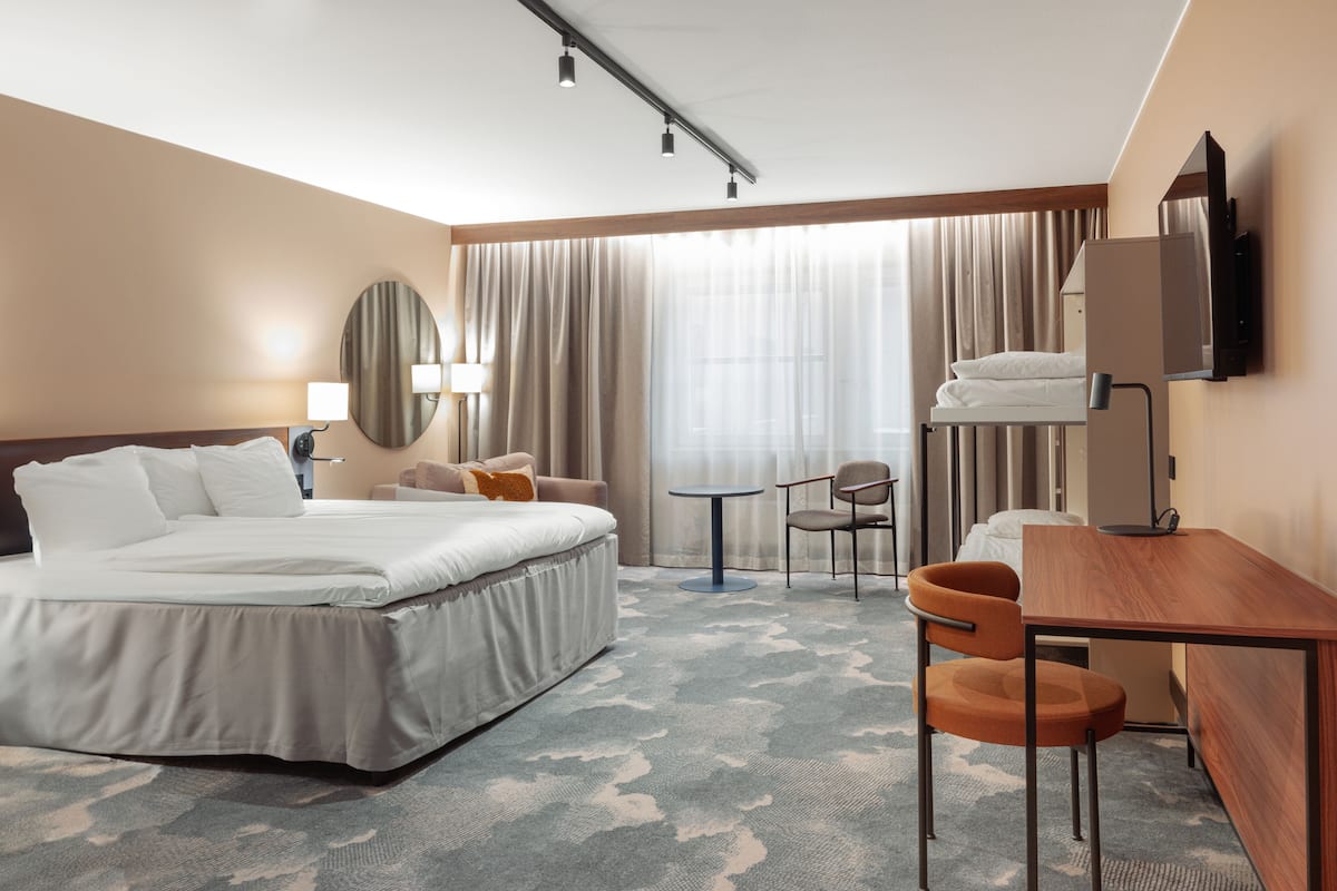 family room, multiple beds, non smoking | living area | flat-screen tv