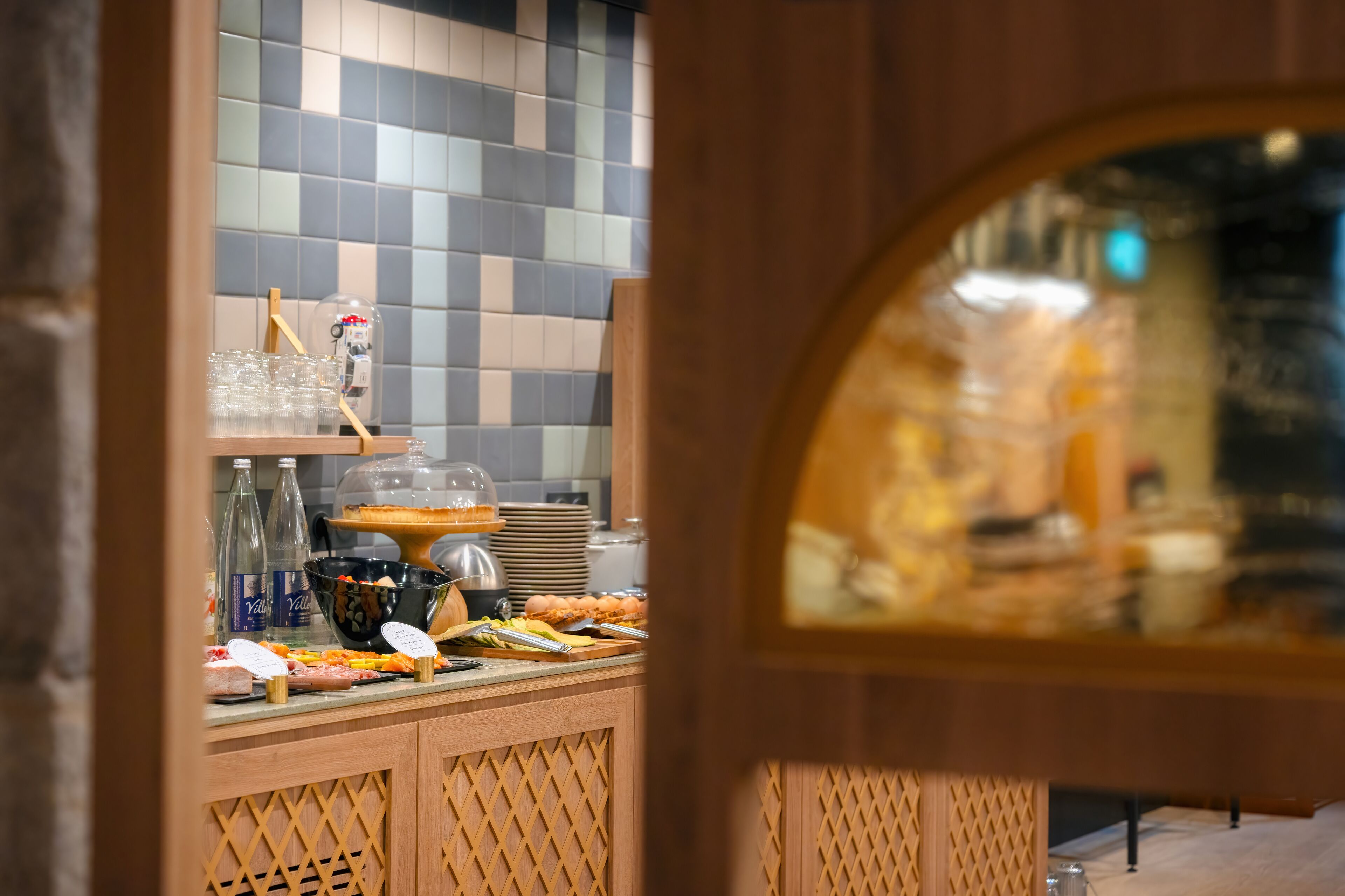 A buffet setup with various food items and beverages.