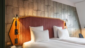 A hotel room with a large bed, two bedside tables, and a wooden headboard. - Hotel Maison Louise Lille Centre - Handwritten Collection (Lille)