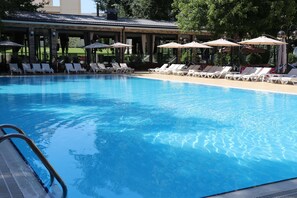 Seasonal outdoor pool, open 8:30 AM to 8:30 PM, pool umbrellas