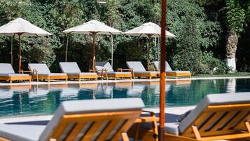 Seasonal outdoor pool, open 8:30 AM to 8:30 PM, pool umbrellas