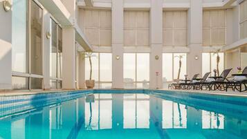 Outdoor pool, open 6:30 AM to 10:00 PM, pool umbrellas, sun loungers