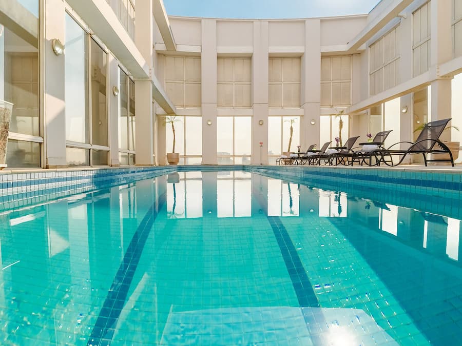 Outdoor pool, open 6:30 AM to 10:00 PM, pool umbrellas, pool loungers