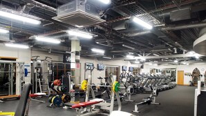 A gym with various exercise equipment, treadmills, and weight machines. - Abbey Court (Nenagh)