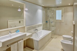 Combined shower/bathtub, eco-friendly toiletries, hair dryer, bathrobes