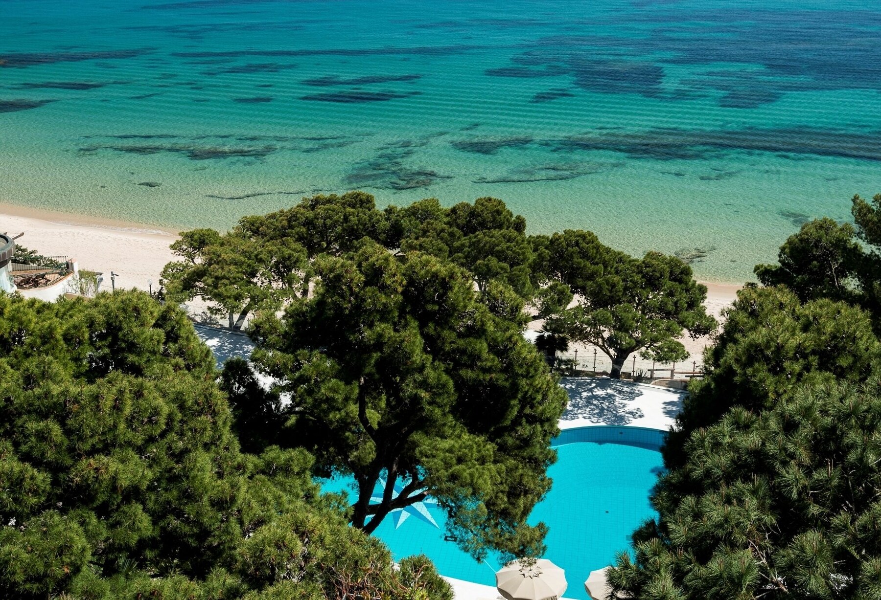 Private beach, white sand, sun loungers, beach umbrellas