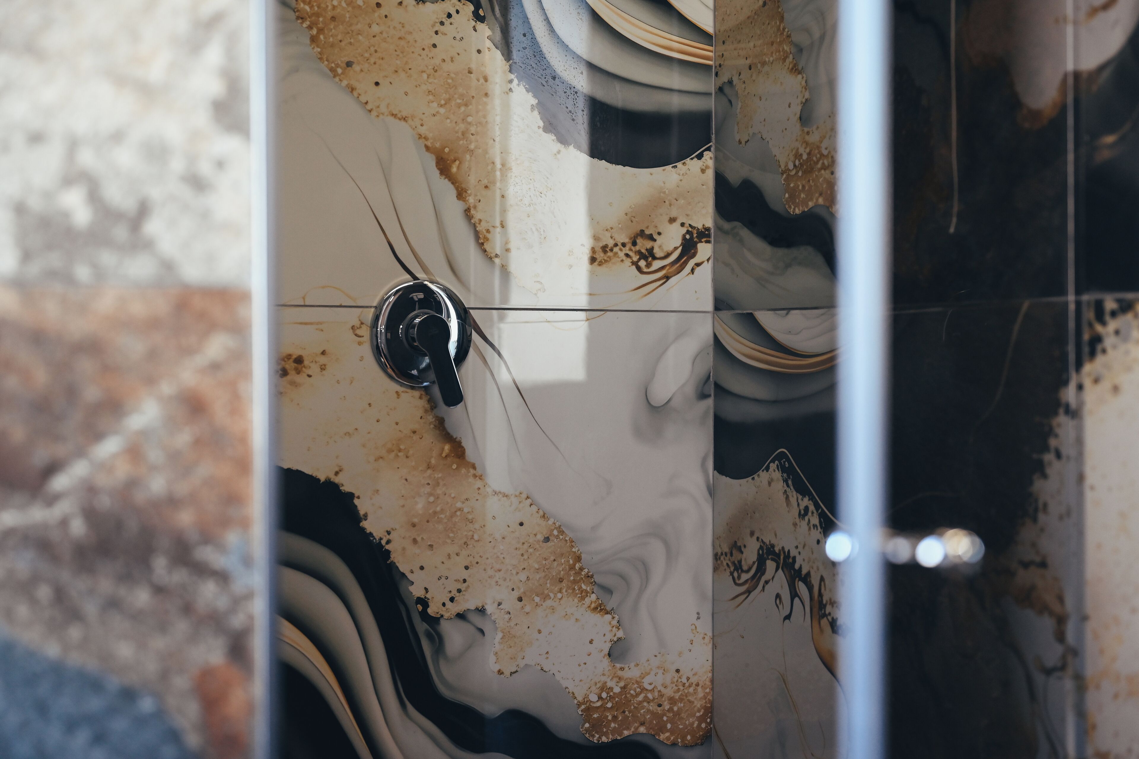 A bathroom with a marble sink and a visible drain.