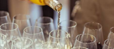 A bottle being poured into a glass.