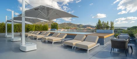 Indoor pool, outdoor pool, open 8:00 AM to 8 PM, pool umbrellas