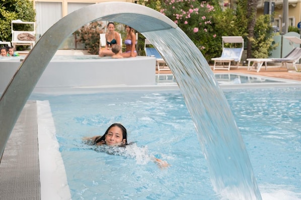 Seasonal outdoor pool, open 10 AM to 7 PM, pool loungers