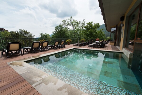 Indoor pool, outdoor pool, open 10 AM to 8 PM, pool umbrellas