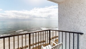 A balcony with a view of the beach and ocean. - Ocean Park Resort by Vacasa (Myrtle Beach)