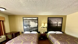 A hotel room with two beds, a desk, a chair, a nightstand with lamps, and a large window with a view of a lake. - Super 8 by Wyndham Shawnee (Shawnee)