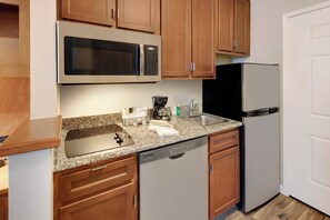 Fridge, microwave, coffee/tea maker, cookware/dishes/utensils