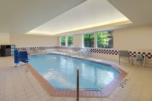 Relax by the pool surrounded by lush views and natural light.