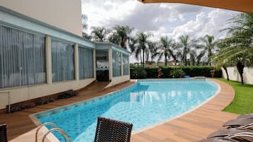 Outdoor pool, open 7:00 AM to 10:00 PM, pool loungers