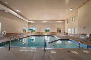 Indoor pool, open 7:00 AM to 10:00 PM, pool loungers - Rodeway Inn & Suites Tomahawk (Tomahawk)