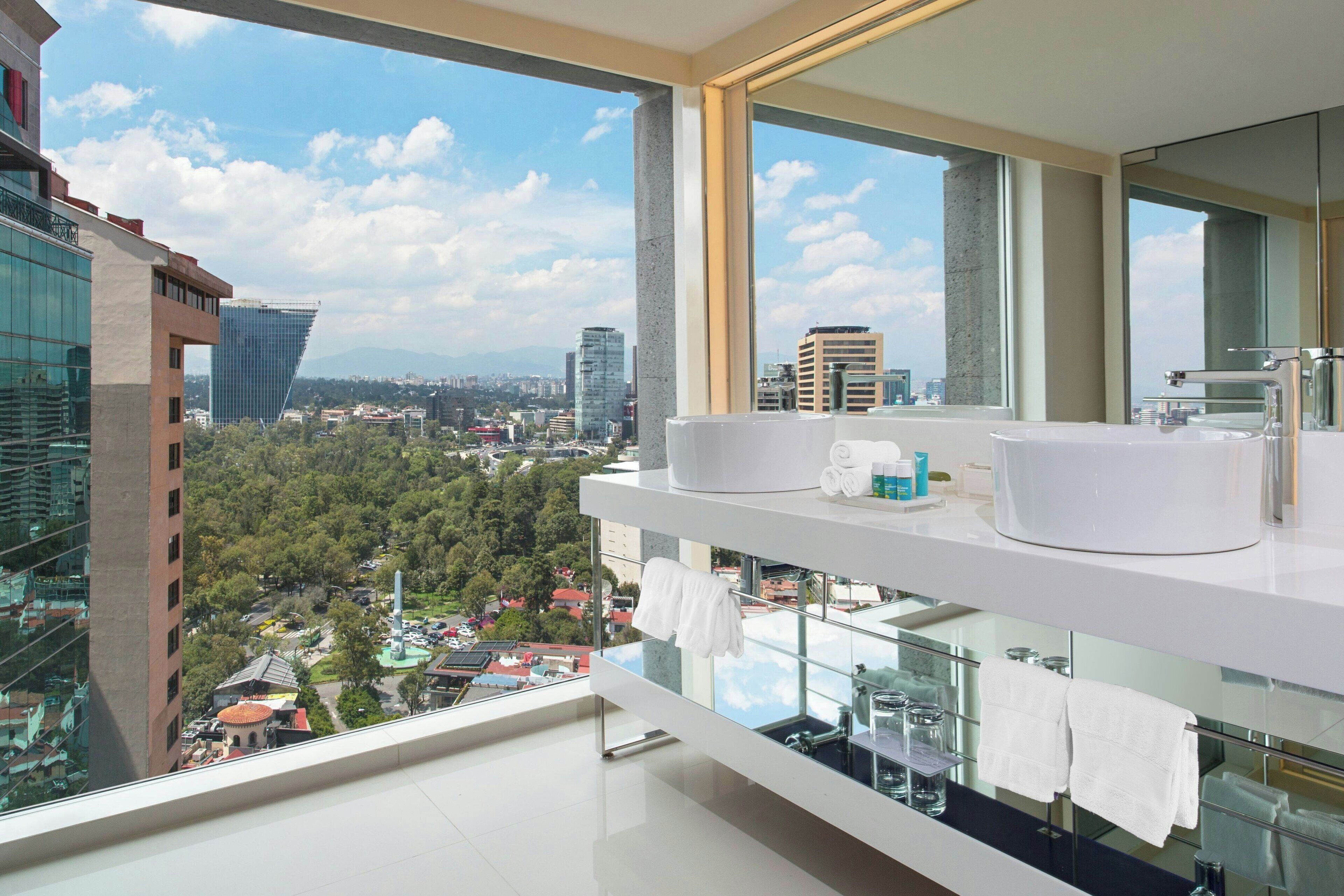 designer toiletries, hair dryer, bathrobes, towels