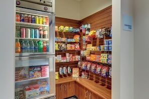 A convenience store with refrigerated beverages, snacks, and packaged foods. - Holiday Inn Express Hotel & Suites Dayton-Centerville by IHG (Dayton)