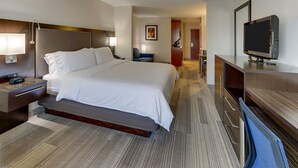 A hotel room with a large bed, bedside tables, a TV, and a desk. - Holiday Inn Express Hotel & Suites Dayton-Centerville by IHG (Dayton)