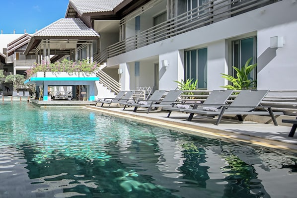 Outdoor pool, open 8:00 AM to 7:00 PM, pool umbrellas, pool loungers