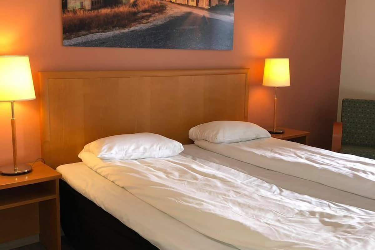 standard double room | living area | 20-inch flat-screen tv with cable channels, tv