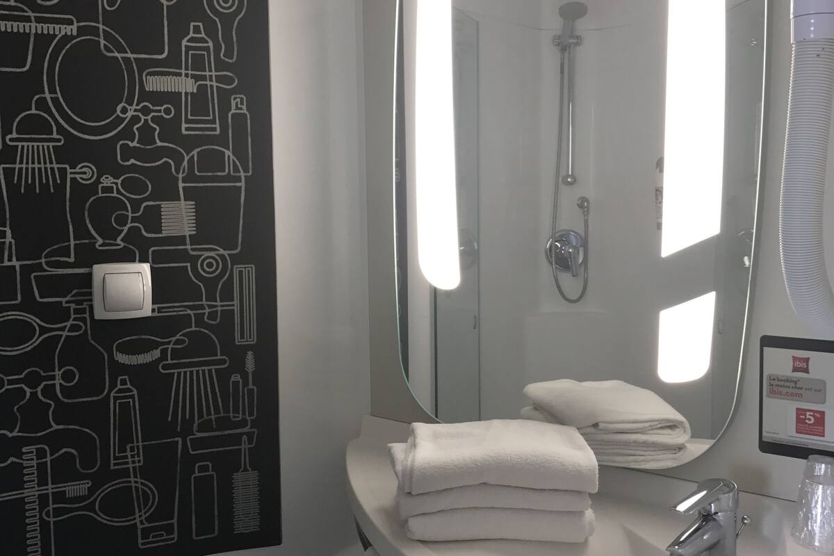 shower, eco-friendly toiletries, hair dryer, towels