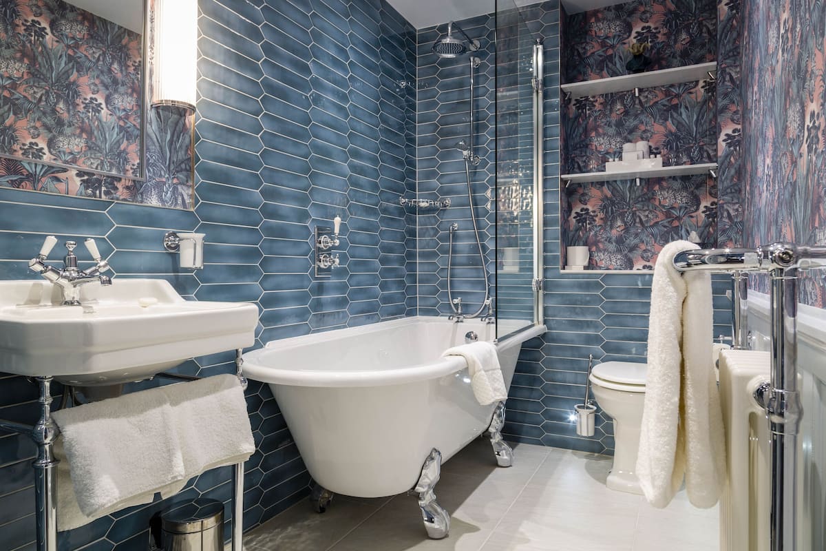 junior suite, 1 queen bed | bathroom | designer toiletries, hair dryer, bathrobes, towels