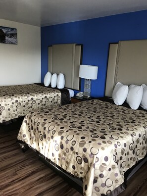 Desk, blackout drapes, iron/ironing board, bed sheets