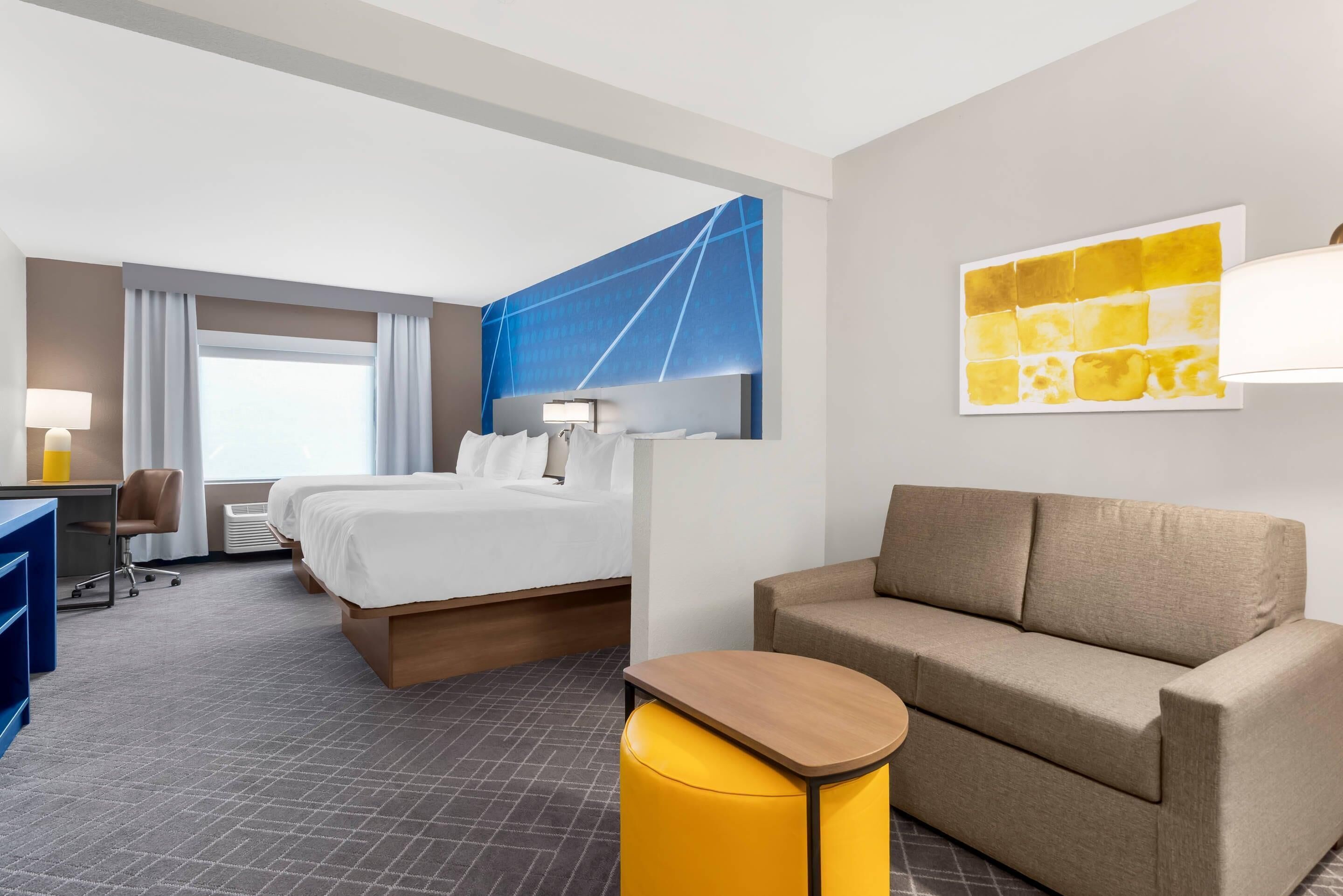 Suite, Multiple Beds, Non Smoking (Upgrade) | Desk, laptop workspace, blackout curtains, iron/ironing board