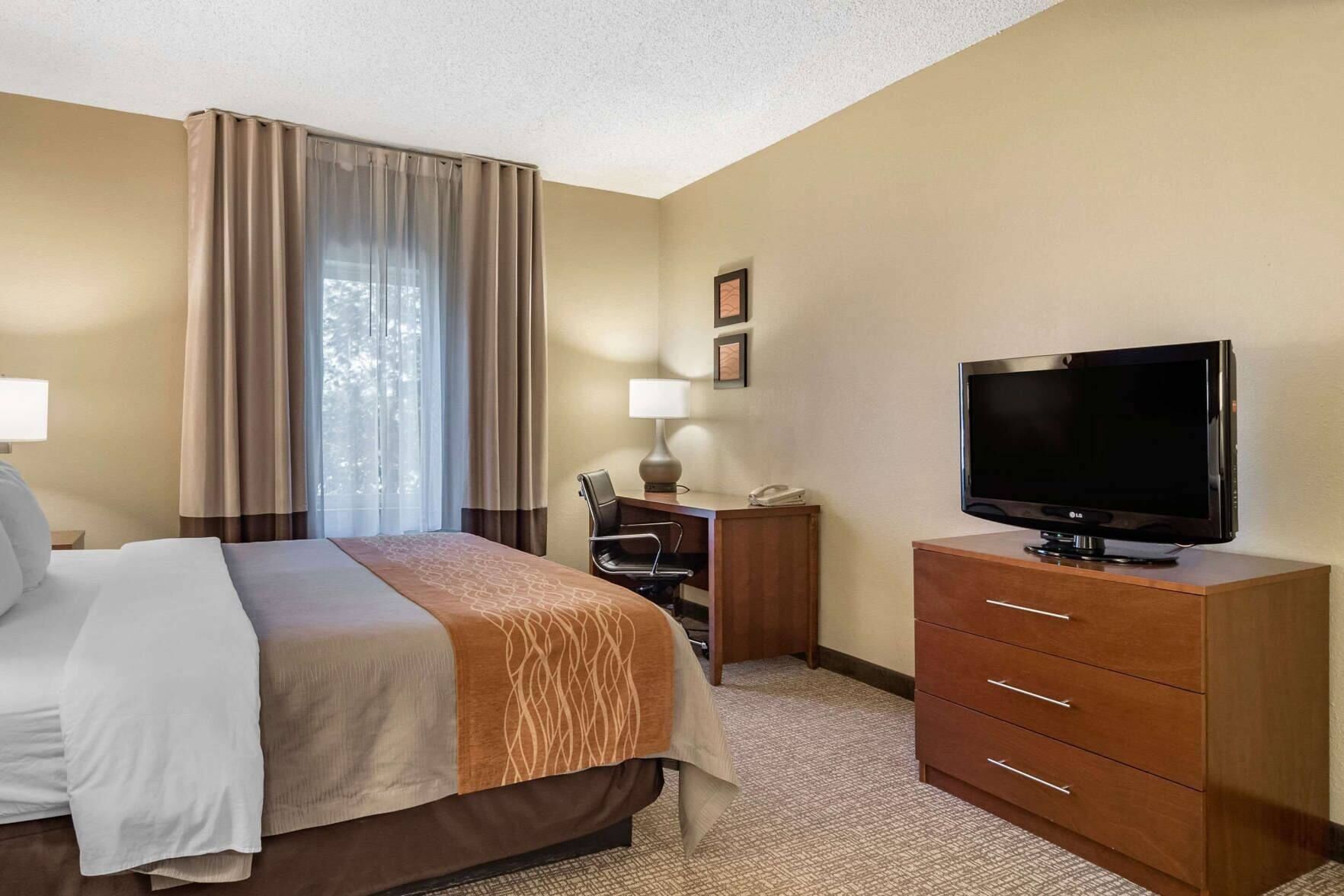 Desk, laptop workspace, blackout curtains, iron/ironing board