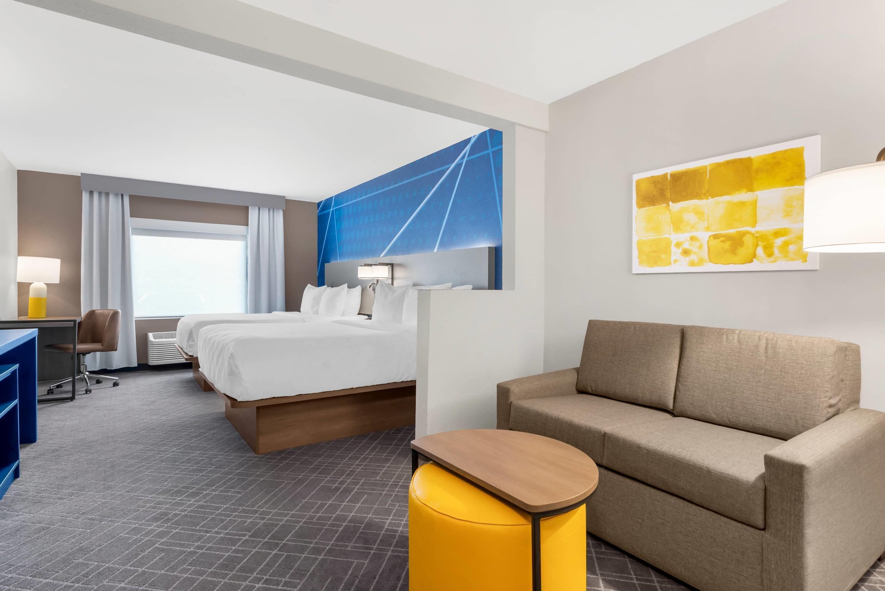 Suite, Multiple Beds, Non Smoking (Upgrade) | Desk, laptop workspace, blackout curtains, iron/ironing board