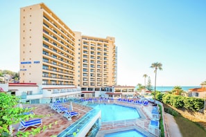 Indoor pool, outdoor pool, pool umbrellas, pool loungers