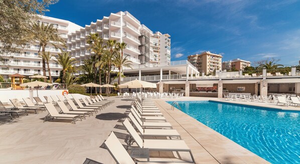 Outdoor pool, a rooftop pool, pool umbrellas