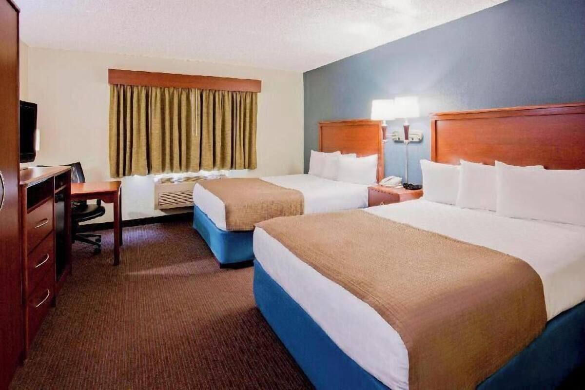 Desk, blackout drapes, iron/ironing board, free cribs/infant beds