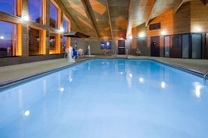 Indoor pool, open 7:00 AM to 11:00 PM, pool loungers