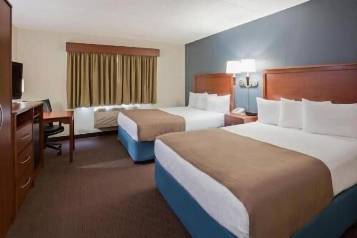 Desk, blackout drapes, iron/ironing board, free cribs/infant beds