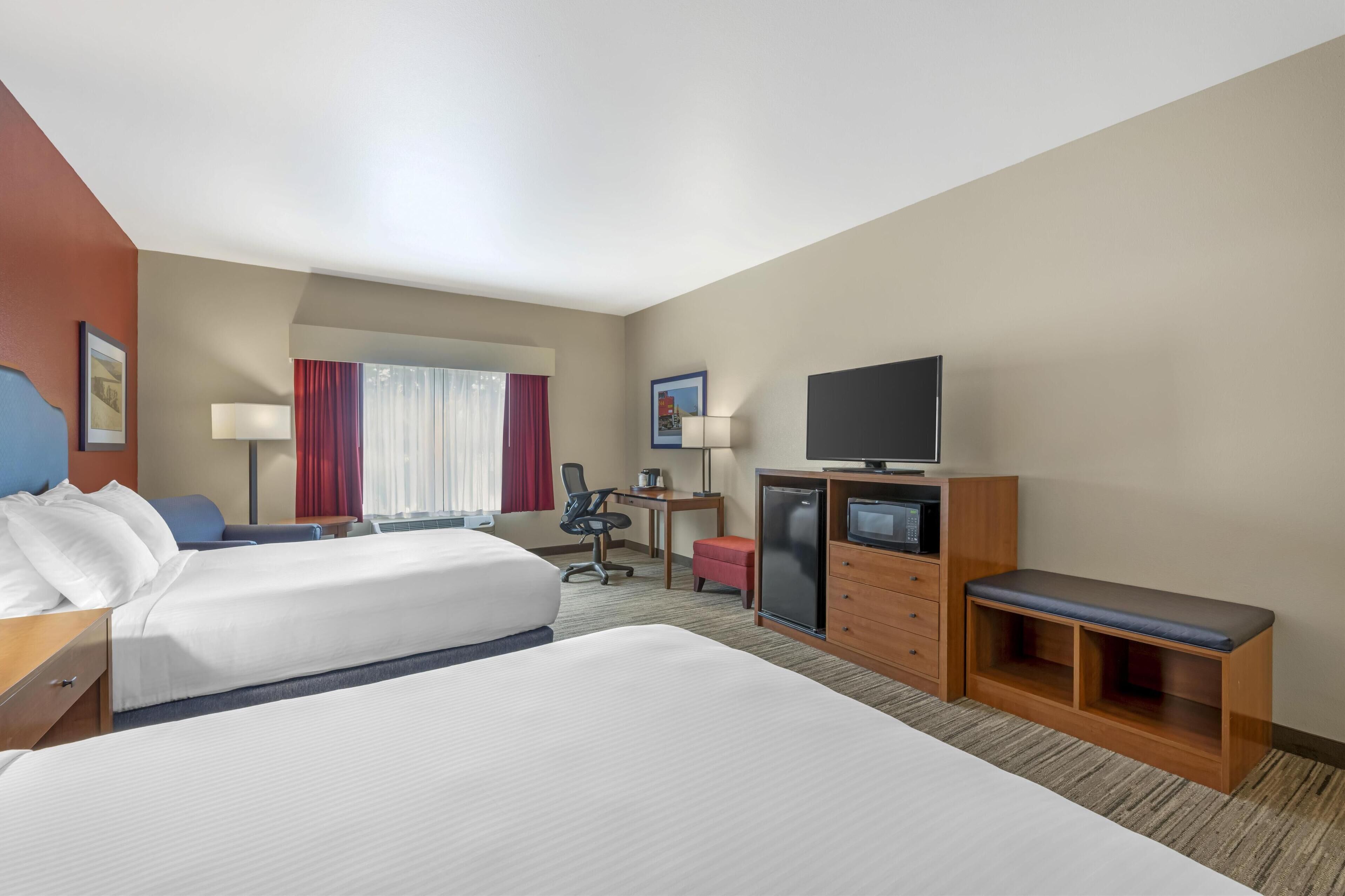 standard room, 2 queen beds, non smoking, refrigerator & microwave (larger room) | desk, laptop workspace, iron/ironing board, wifi