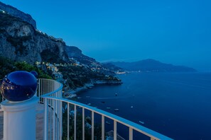 Enjoy breathtaking views of the calm sea from a cliffside vantage point.