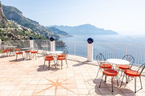 Enjoy breathtaking views of the sea and distant mountains from this expansive outdoor space.