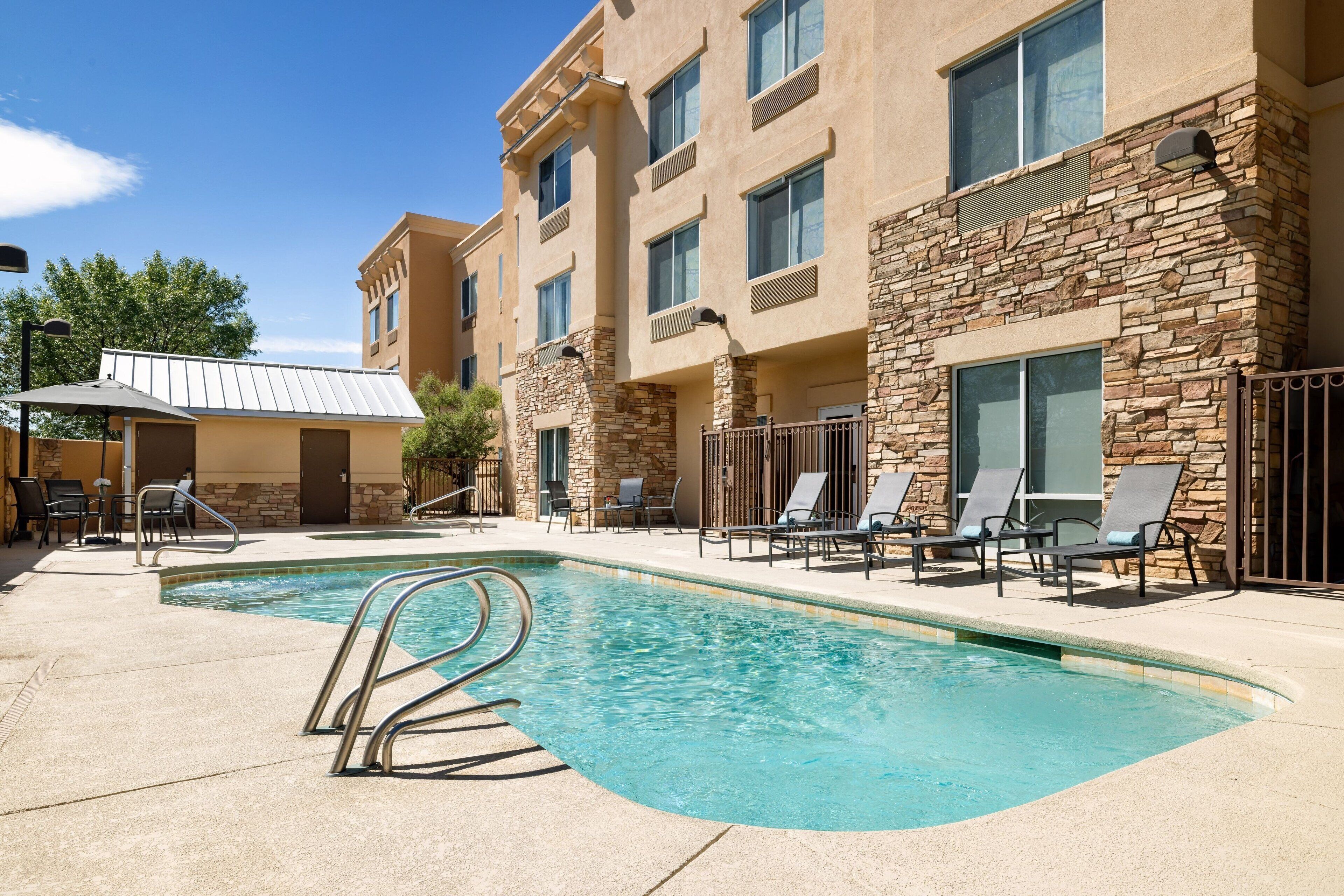 outdoor pool, open 7 am to 10 pm, pool umbrellas, pool loungers