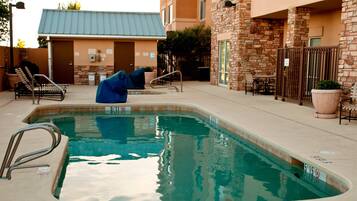 Outdoor pool, open 7 AM to 10 PM, pool umbrellas, pool loungers