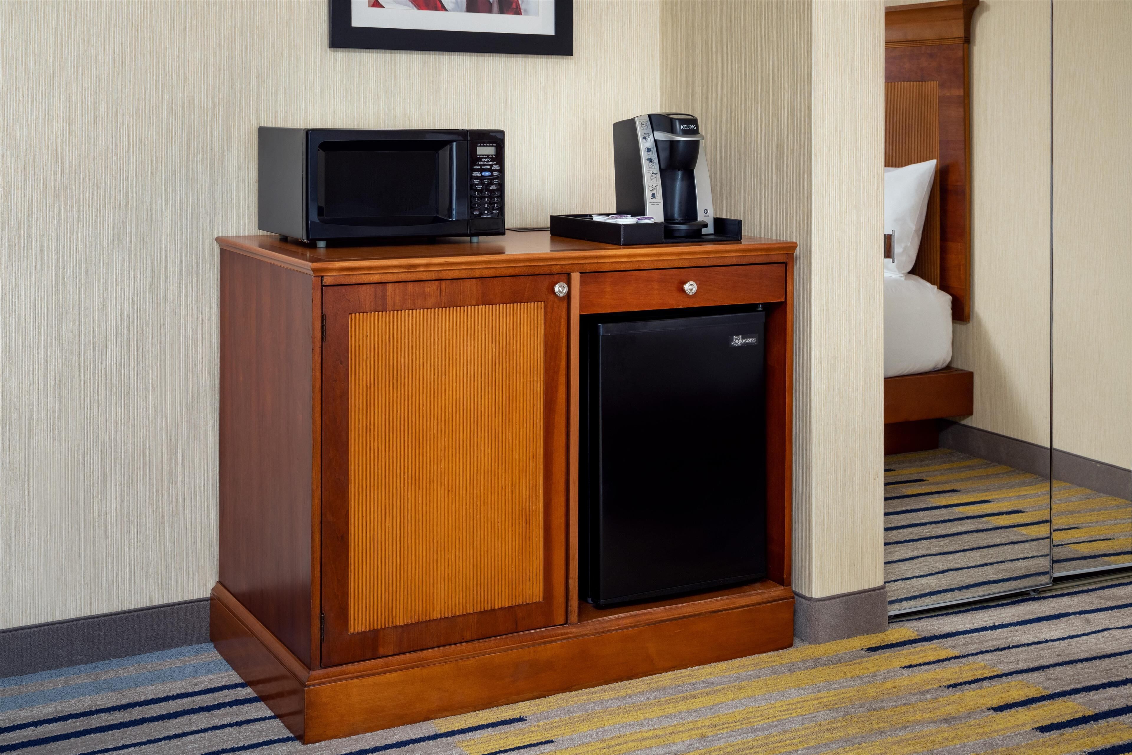 hypo-allergenic bedding, desk, laptop workspace, blackout curtains