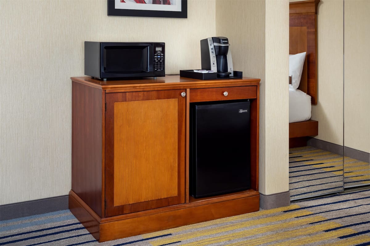 hypo-allergenic bedding, desk, laptop workspace, blackout curtains