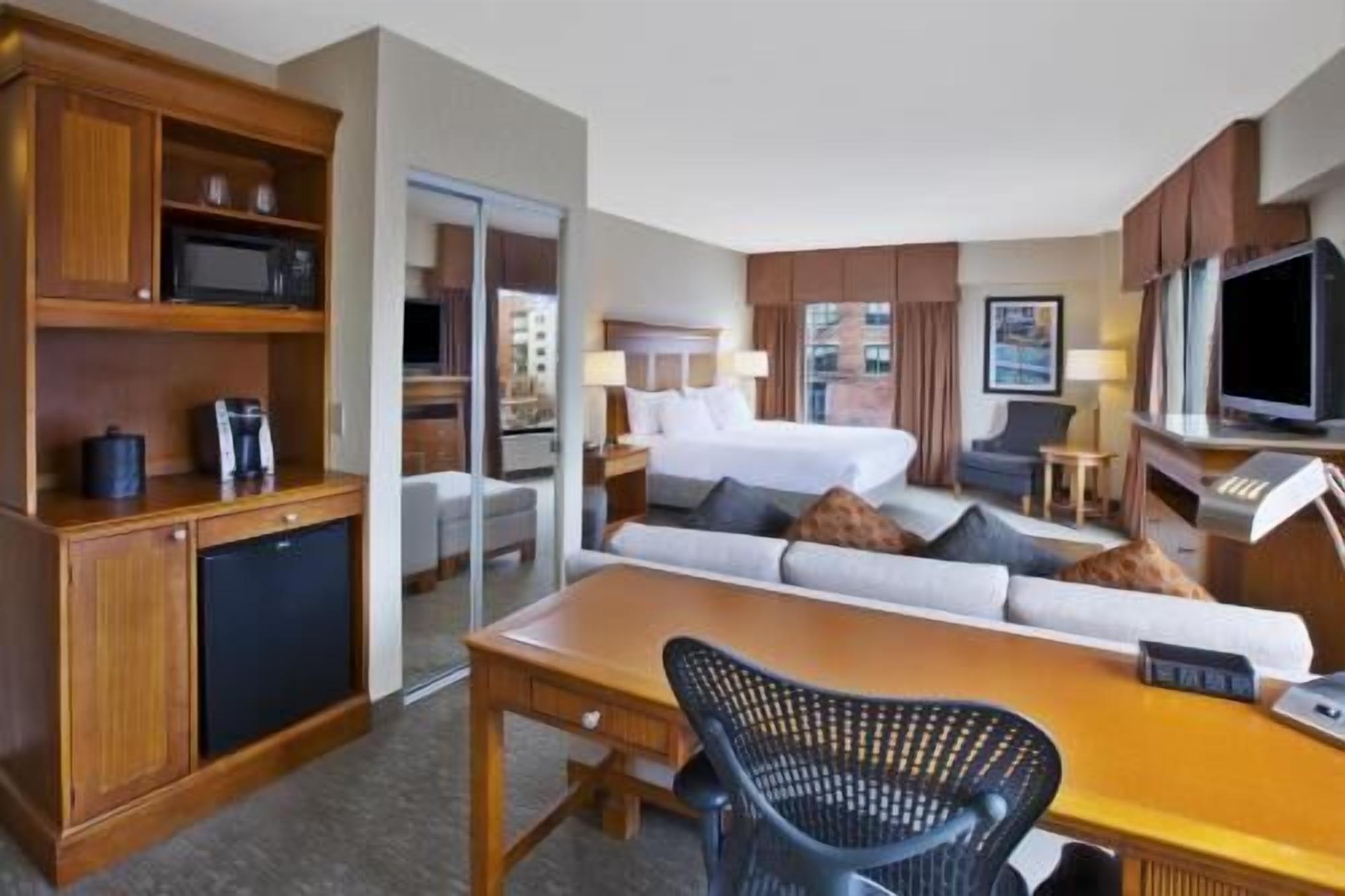 Hypo-allergenic bedding, desk, laptop workspace, blackout curtains