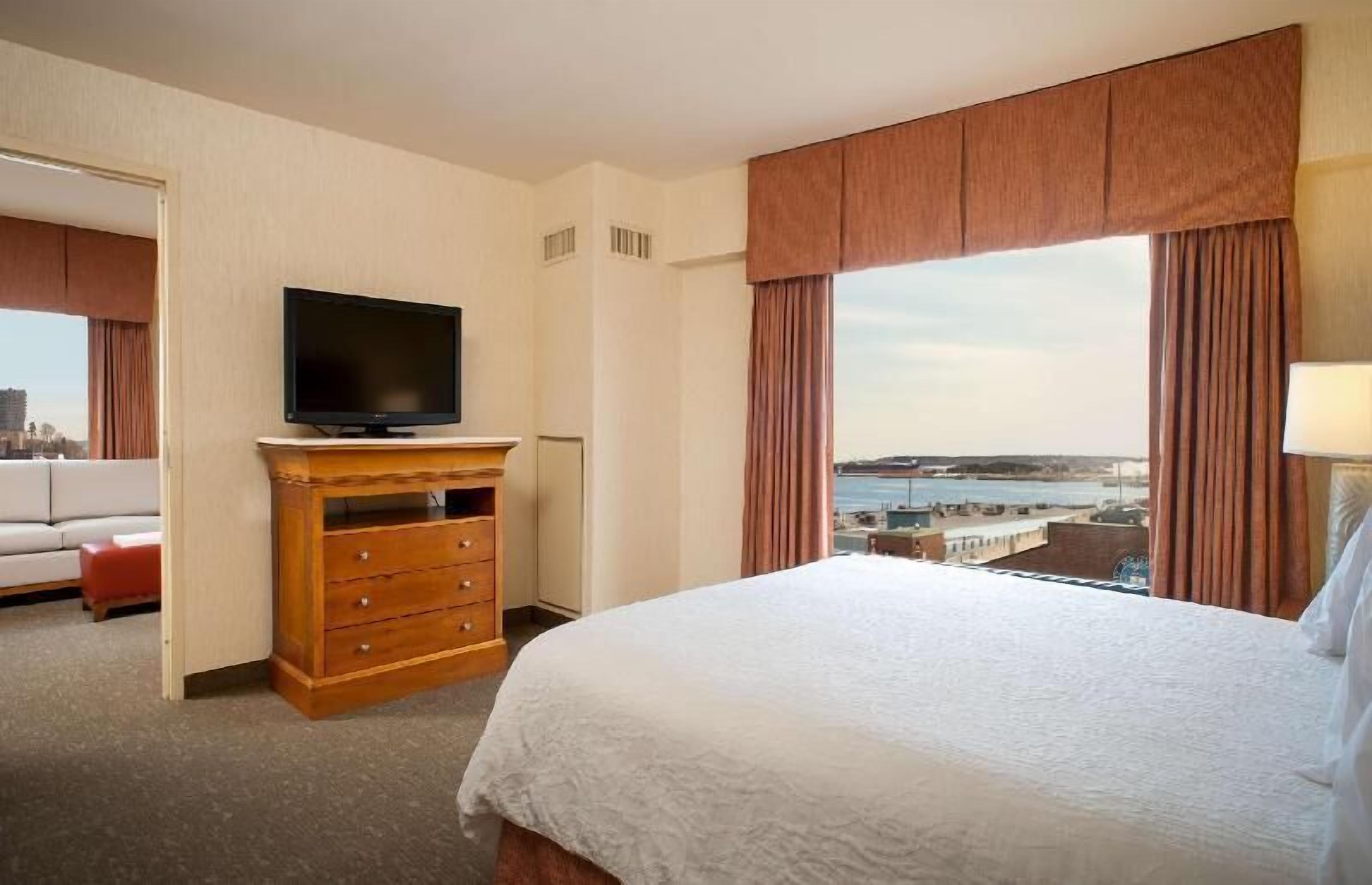 Hypo-allergenic bedding, desk, laptop workspace, blackout curtains